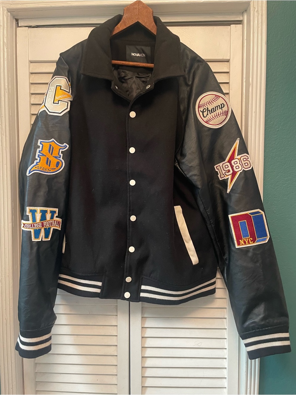 Black Varsity Bomber Jacket with Leather Sleeves and Patch Accents
